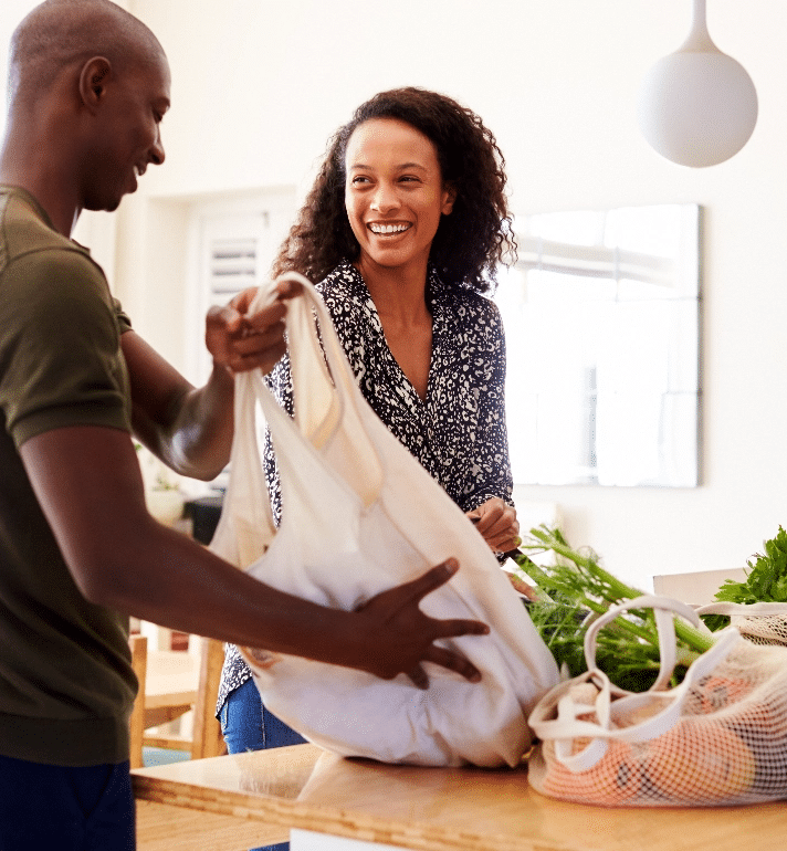 couple unpacking groceries