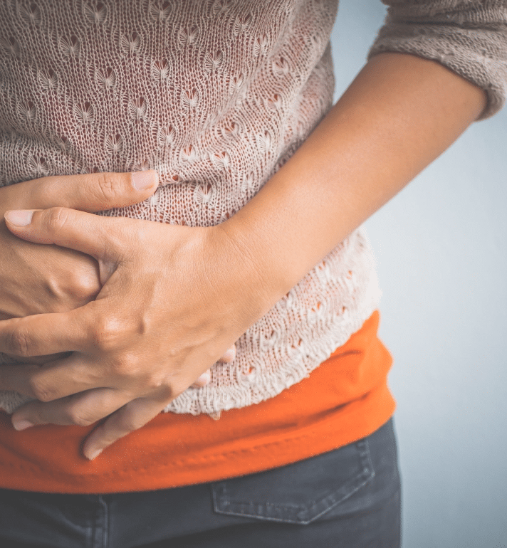 woman holding stomach